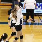Homer senior Karmyn Gallios hits the ball across the net to Kodiak during a Thursday, Aug. 29, 2019 volleyball game at the Alice Witte Gymnasium in Homer, Alaska. (Photo by Megan Pacer/Homer News)