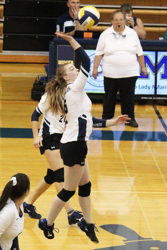 Homer senior Karmyn Gallios hits the ball across the net to Kodiak during a Thursday, Aug. 29, 2019 volleyball game at the Alice Witte Gymnasium in Homer, Alaska. (Photo by Megan Pacer/Homer News)