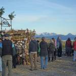 Visitors interact with the 2018 Burning Basket, Dream, on Sept. 9, 2018, at Mariner Park in Homer, Alaska. (Photo by Michael Armstrong/Homer News)