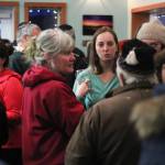 Photo by Megan Pacer/Homer News                                 A crowd of people talks and mingles at the First Friday opening Friday, Feb. 1, 2019 at Grace Ridge Brewery in Homer, Alaska. The winning label for a special Brackish Brown ale was unveiled at the event.