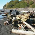 An abandoned Yamaha ATV sits on the Diamond Creek beach on Oct. 9, 2011, near Homer, Alaska. CoastWalk volunteers document beach trash such as this  and try to collect it. (Homer News file photo)