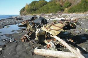 An abandoned Yamaha ATV sits on the Diamond Creek beach on Oct. 9, 2011, near Homer, Alaska. CoastWalk volunteers document beach trash such as this  and try to collect it. (Homer News file photo)