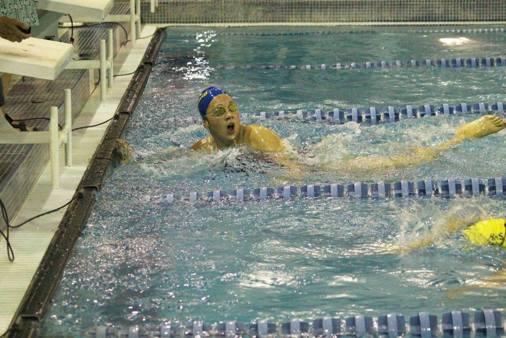 Kodiaks Leslie Spear swims past Homers Bristol Johnson to snag first place for the Bears in the girls 400 yard freestyle relay during the Homer Invite on Saturday, Sept. 7, 2019 at the Kate Kuhns Aquatic Center in Homer, Alaska. (Photo by Megan Pacer/Homer News)