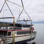 Operators of an Alaska Crane Liebherr LTM 1500 mobile hydraulic crane move the Goldbelt Seawolf at its launch on Tuesday, Sept. 10, 2019, at the Northern Enterprises Boatyard in Homer, Alaska. The crane held the Seawolf over the water until the tide had come in. (Photo by Michael Armstrong/Homer News)