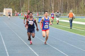 Homers Eyoab Knapp runs to the finish line of the boys Division II cross country race Saturday, Sept. 7, 2019 at the Palmer Invite in Palmer, Alaska. (Photo by Tim Rockey/Frontiersman)