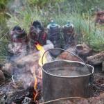 Water boils on a fire at a campsite at Tutka Lake in August, 2019 across Kachemak Bay from Homer, Alaska. (Photo by Megan Pacer/Homer News)