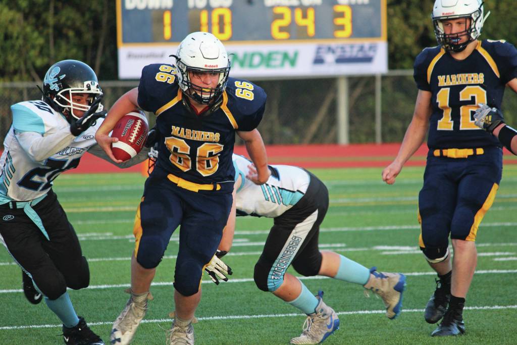 Homers River Mann takes the ball up the field during a Friday, Sept. 13, 2019 football game against Valdez High School on the Mariner field in Homer, Alaska. (Photo by Megan Pacer/Homer News)