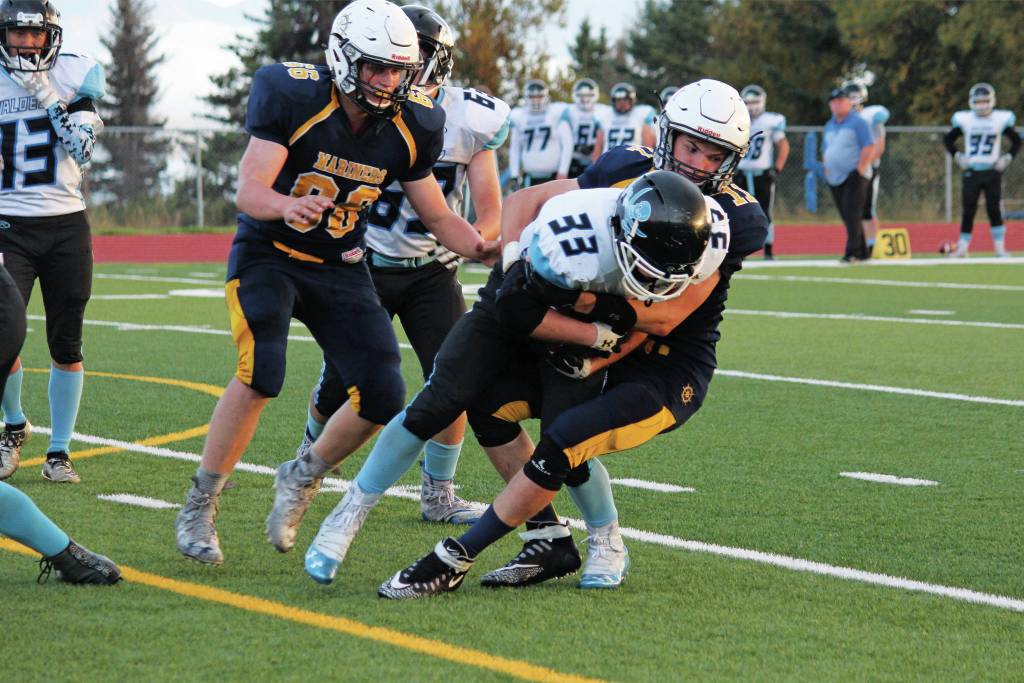 Homers Josh Bradshaw tackles Hayden Howard of Valdez High School during a Friday, Sept. 13, 2019 football game between the two teams at Homer High School in Homer, Alaska. (Photo by Megan Pacer/Homer News)