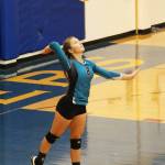 Nikiskis Kaitlyn Johnson serves the ball to the Hoemr Mariners during a Saturday, Sept. 14, 2019 volleyball game at Homer High School in Homer, Alaska. (Photo by Megan Pacer/Homer News)