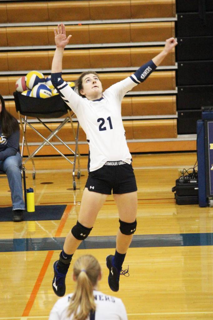 Homers Marina Carroll jumps the hit the ball during a Saturday, Sept. 14, 2019 game against Nikiski at Homer High School in Homer, Alaska. (Photo by Megan Pacer/Homer News)