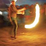 Aaron Stillwell spins fire at Radiate, the 16th annual Burning Basket, as it burns down on Sunday night, Sept. 15, 2019, at Mariner Park on the Homer Spit in Homer, Alaska. (Photo by Michael Armstrong/Homer News)