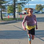Jane Wiebe runs to the finish line of the Homer Mariner Triathlon on Saturday, Sept. 14, 2019 in Homer, Alaska. (Photo by Megan Pacer/Homer News)