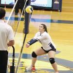 Photos by Megan Pacer / Homer News                                Homers Katlyn Vogl digs the ball out of the net during a game against Palmer High School on Thursday, Sept. 12.