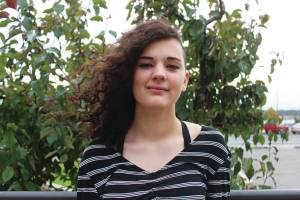 Emma Sulczynski, a sophomore at Homer High School, stands outside the school on Tuesday, Sept. 24, 2019 in Homer, Alaska. (Photo by Megan Pacer/Homer News)