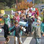 As part of their weekly Friday walks to local parks, Little Fireweed Academy students held a We love the Earth March to WKFL Park on Sept. 20, 2019, in Homer, Alaska. The kindergarten through second-grade students have been learning about ecology and animals and their connection to the earth. The march wasnt associated with the Strike for the Climate held the same day. (Photo by Michael Armstrong/Homer News)