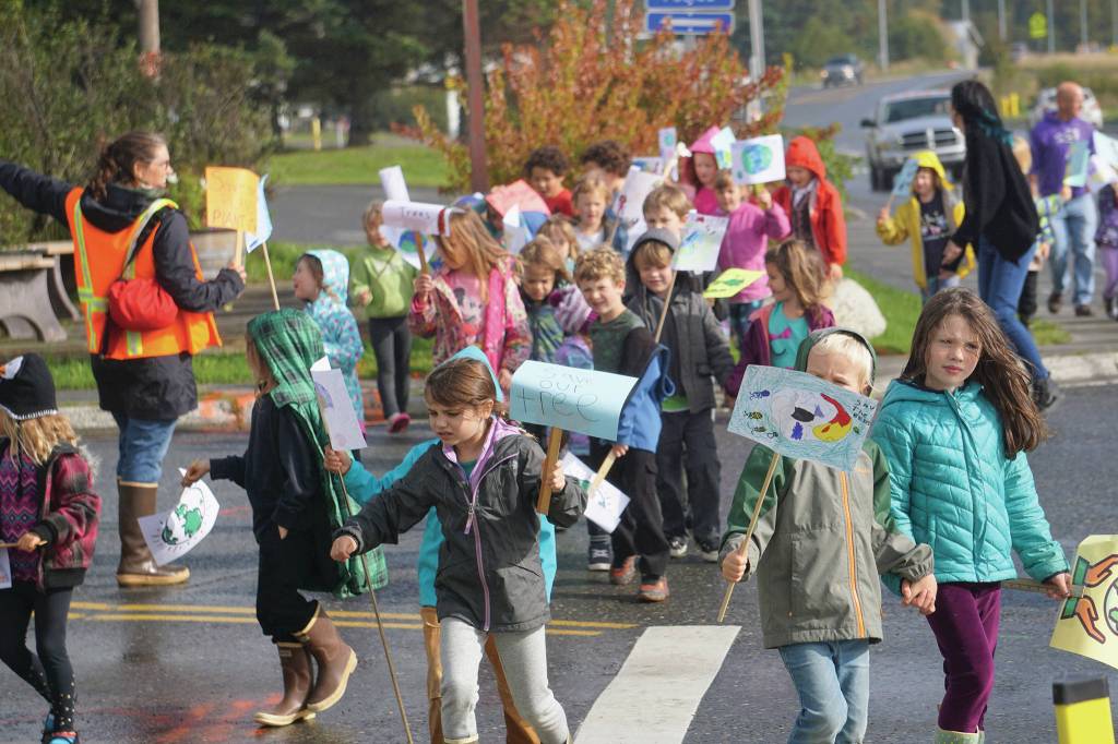 As part of their weekly Friday walks to local parks, Little Fireweed Academy students held a We love the Earth March to WKFL Park on Sept. 20, 2019, in Homer, Alaska. The kindergarten through second-grade students have been learning about ecology and animals and their connection to the earth. The march wasnt associated with the Strike for the Climate held the same day. (Photo by Michael Armstrong/Homer News)