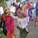 As part of their weekly Friday walks to local parks, Little Fireweed Academy students held a We love the Earth March to WKFL Park on Sept. 20, 2019, in Homer, Alaska. The kindergarten through second-grade students have been learning about ecology and animals and their connection to the earth. The march wasnt associated with the Strike for the Climate held the same day. (Photo by Michael Armstrong/Homer News)