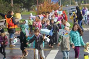 As part of their weekly Friday walks to local parks, Little Fireweed Academy students held a We love the Earth March to WKFL Park on Sept. 20, 2019, in Homer, Alaska. The kindergarten through second-grade students have been learning about ecology and animals and their connection to the earth. The march wasnt associated with the Strike for the Climate held the same day. (Photo by Michael Armstrong/Homer News)