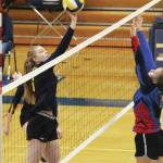 Homers Karmyn Gallios tips the ball over the net to the Anchorage Christian Schools Lions during a Saturday, Sept. 28, 2019 volleyball game in the Alice Witte Gymnasium in Homer, Alaska. (Photo by Megan Pacer/Homer News)