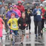 Photo by Jeff Helminiak/Peninsula Clarion                                 Runners dash from the start of the 5-kilometer race Sunday, Sept. 29, 2019, at the Kenai River Marathon.