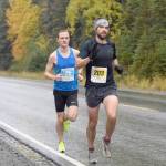 Photo by Jeff Helminiak/Peninsula Clarion                                 Anchorages Marshall Genn leads Soldotnas Jason Parks on Sunday, Sept. 29, 2019, at the Kenai River Marathon in Alaska. Genn won the Half Marathon, while Parks won the Marathon.