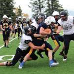 Photo by Megan Pacer/Homer News                                 Homers Antonin Maruchev powers through a group of Nikiski defenders during a Saturday, Sept. 28 football game at Homer High School in Homer.