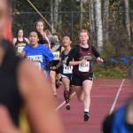 Nikolaevsks Isabella Hickman approaches the finish of the Div. III girls state cross-country championships Saturday, Oct. 5, 2019, on the Bartlett High trails in Anchorage, Alaska. (Photo by Joey Klecka/Peninsula Clarion)