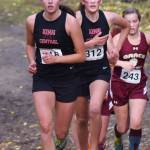 Kenai Central teammates Logan Satathite (front) and Leah Fallon race together in the Div. II girls state cross-country championships Saturday, Oct. 5, 2019, on the Bartlett High trails in Anchorage, Alaska. (Photo by Joey Klecka/Peninsula Clarion)