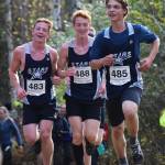 The Soldotna trio of Zachary Burns (left), Anchor Musgrave (middle) and Quinn Cox run for position in the Div. I boys state cross-country championships Saturday, Oct. 5, 2019, on the Bartlett High trails in Anchorage, Alaska. (Photo by Joey Klecka/Peninsula Clarion)