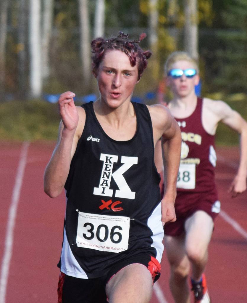 Kenais Maison Dunham runs to a third-place finish in the Div. II boys state cross-country championships Saturday, Oct. 5, 2019, on the Bartlett High trails in Anchorage, Alaska. (Photo by Joey Klecka/Peninsula Clarion)