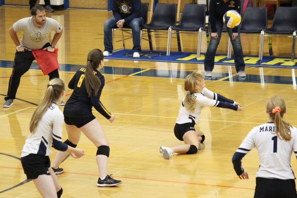 Sela Weisser digs the ball during a Tuesday, Oct. 8, 2019 volleyball game between Homer High School and Soldotna High School in the Alice Witte Gymnasium in Homer, Alaska. (Photo by Megan Pacer/Homer News)