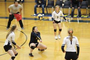 Homers Kitri Classen digs a ball during a Tuesday, Oct. 8, 2019 volleyball game against Soldotna High School in the Alice Witte Gymnasium in Homer, Alaska. (Photo by Megan Pacer/Homer News)