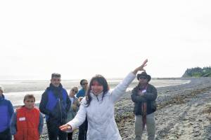 Emily Johnson conducts a land acknowledgment of Bishops Beach as Tuggeght, the Denaina word for beluga, at the art event, SHORE: Tuggeght, on Nov. 7, 2018, in Homer, Alaska. (Photo provided)