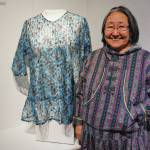 Homer artist Martha Murray stands by her kuspuk at the opening of the Kuspuk/Qaspeq/Atikluk show on Oct. 5, 2019, at Bunnell Street Arts Center in Homer, Alaska. (Photo by Michael Armstrong/Homer News)