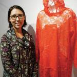 Bobby Itta of Utgiagvik stands next to her atikluk at the opening of the Kuspuk/Qaspeq/Atikluk show on Oct. 5, 2019, at Bunnell Street Arts Center in Homer, Alaska. Itta made the atikluk in honor of her sister, Nancy, a murder victim. (Photo by Michael Armstrong/Homer News)