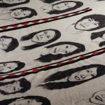 Some of the faces of Amber Webbs kuspuk at the opening of the Kuspuk/Qaspeq/Atikluk show on Oct. 5, 2019, at Bunnell Street Arts Center in Homer, Alaska. The kuspuk shows images of missing or murdered indigenous women. (Photo by Michael Armstrong/Homer News)