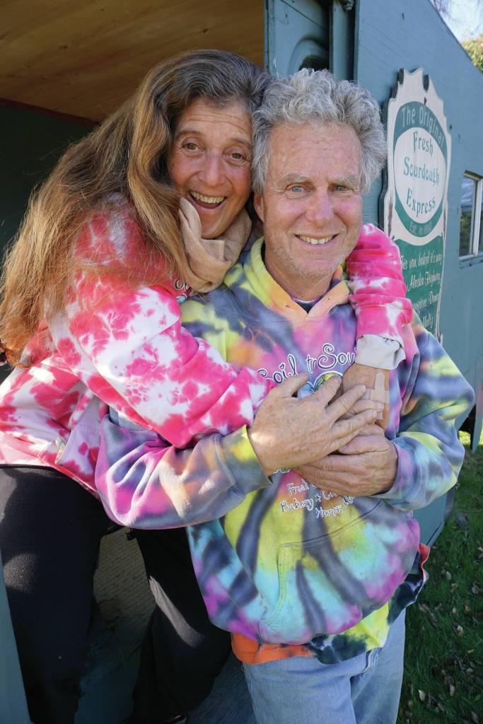 Photo by Michael Armstrong/Homer News                                 Donna and Kevin Maltz pose in the original Fresh Sourdough Express Bakery and Cafe van on Sept. 27, as the landmark business held a going-out-of-business garage sale at its Ocean Drive location in Homer.