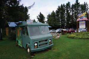 The original van of the Fresh Sourdough Express Bakery and Cafe marks the business origins. The landmark business closed last month in Homer, Alaska. (Photo by Michael Armstrong/Homer News)