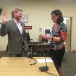 Joey Evensen is sworn in as a new member of the Homer City Council by City Clerk Melissa Jacobsen at a Monday, Oct. 14, 2019 council meeting at Homer City Hall in Homer, Alaska. Evensen won one of two open seats on the council with the majority of votes in the Oct. 1 municipal election. (Photo by Megan Pacer/Homer News)