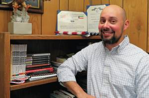 Joshua Hinds, principal of Chapman School, stands in his office in this undated photo at the school in Anchor Point, Alaska. (Photo courtesy Joshua Hinds)
