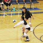 Seward High Schools Angel Purigay digs the ball during a Friday, Oct. 18, 2019 volleyball game against Homer High School in the Alice Witte Gymnasium in Homer, Alaska. (Photo by Megan Pacer/Homer News)