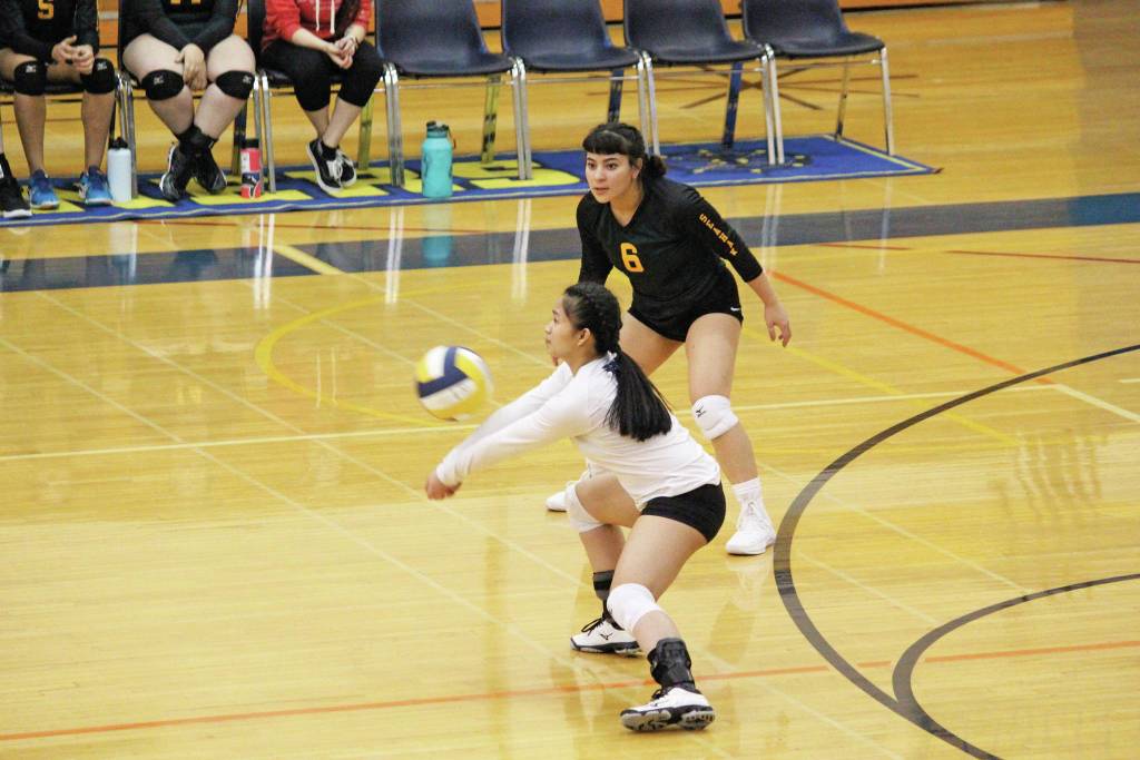 Seward High Schools Angel Purigay digs the ball during a Friday, Oct. 18, 2019 volleyball game against Homer High School in the Alice Witte Gymnasium in Homer, Alaska. (Photo by Megan Pacer/Homer News)