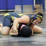 Homers Mischelle Wells tries to flip Nikiskis Tawnisha Freeman over during the Best Western Bidarka Round Robin Rumble wrestling tournament Saturday, Oct. 19, 2019 in the Alice Witte Gymnasium in Homer, Alaska. (Photo by Megan Pacer/Homer News)