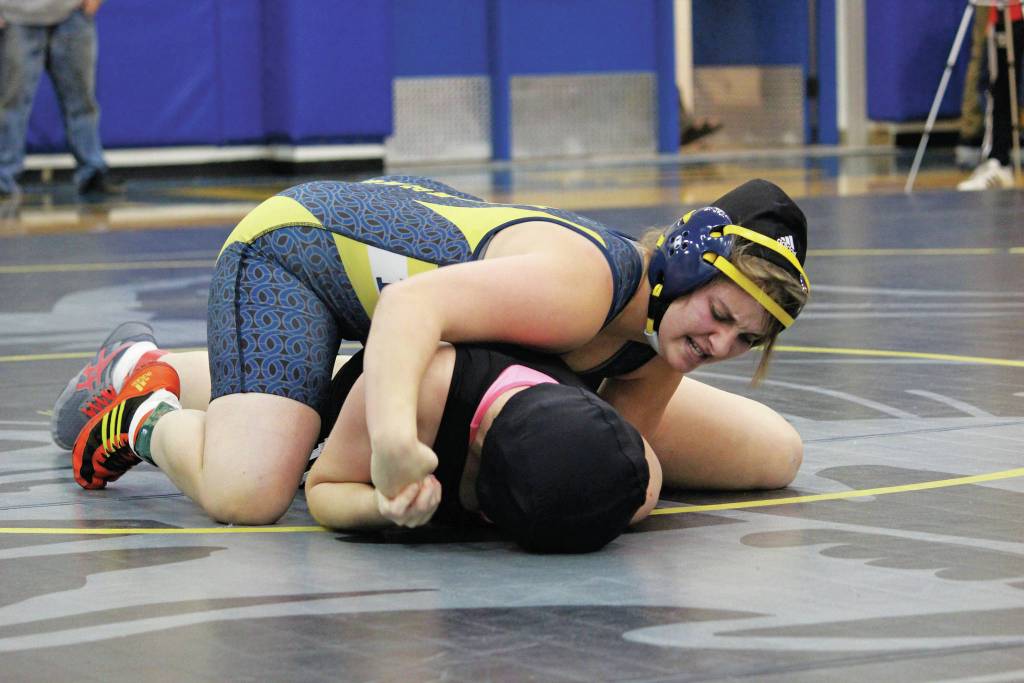 Homers Mischelle Wells tries to flip Nikiskis Tawnisha Freeman over during the Best Western Bidarka Round Robin Rumble wrestling tournament Saturday, Oct. 19, 2019 in the Alice Witte Gymnasium in Homer, Alaska. (Photo by Megan Pacer/Homer News)