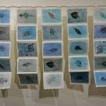 Kathy Smiths Prayer Flags for Glaciers, a series of prints in her exhibit, Rivers of Ice, showing at the Pratt Museum through Dec. 28. 2019, in Homer, Alaska. (Photo by Michael Armstrong/Homer News)