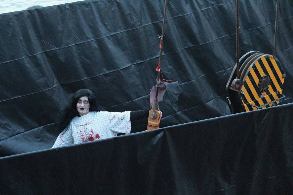 A member of the Haunted Hickory prepares to scare guests on the deck of the US Coast Guard Cutter Hickory on Friday, Oct. 25, 2019 at the harbor in Homer, Alaska. (Photo by Megan Pacer/Homer News)