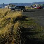 The Seafarers Memorial parking lot is mostly empty on Oct. 25, 2019, on the Homer Spit in Homer, Alaska. The city has applied for a conditional use permit to fill in and extend the parking lot to the left in this photo, or toward the beach. The angled parking spaces by the Homer Spit Road also would be removed except in front of the Cannery Row Boardwalk. (Photo by Michael Armstrong/Homer News)