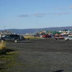 The Seafarers Memorial parking lot is mostly empty on Oct. 25, 2019, on the Homer Spit in Homer, Alaska. The city has applied for a conditional use permit to fill in and extend the parking lot to the left in this photo, or toward the beach. The angled parking spaces by the Homer Spit Road also would be removed except in front of the Cannery Row Boardwalk.(Photo by Michael Armstrong/Homer News)