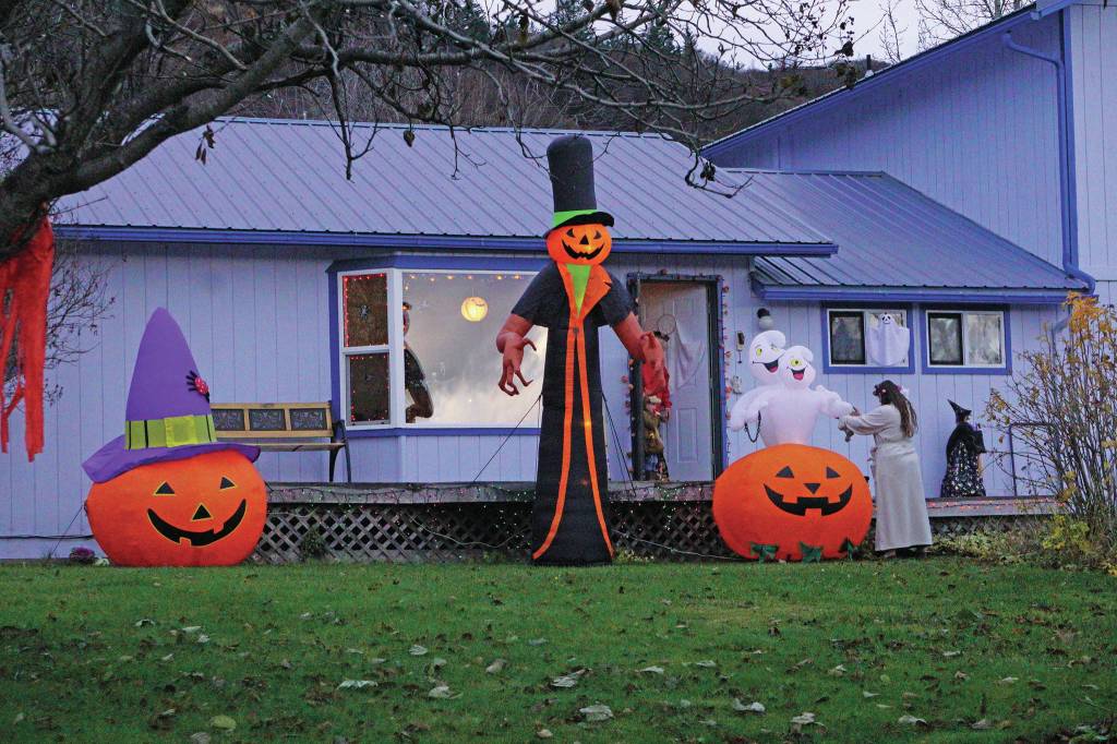 Halloween trick-or-treaters visit the Linda and David Etzwiler home, one of several homes decorated on Bayview Avenue, on Oct. 31, 2019, in Homer, Alaska. (Photo by Michael Armstrong/Homer News)