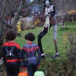 Halloween trick-or-treaters look at decorations at the Sean and Sandra Perry home on Oct. 31, 2019, in Homer, Alaska. (Photo by Michael Armstrong/Homer News)